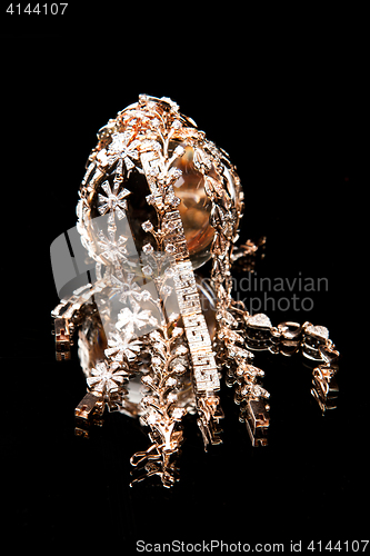 Image of Golden Bracelets On A Glass