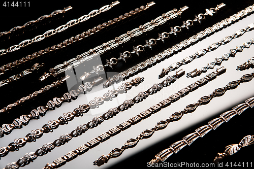 Image of Golden Bracelets On A Glass