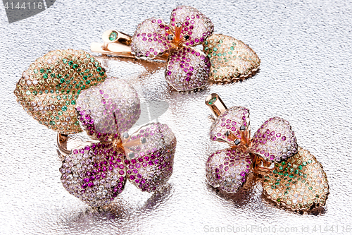 Image of Handmade Ring And Earrings On Metal Background