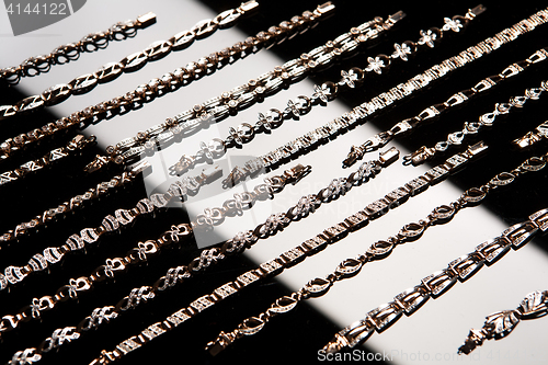 Image of Golden Bracelets On A Glass