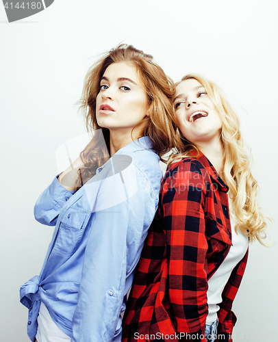 Image of two pretty blond woman having fun together on white background, mature mother and young teenage daughter, lifestyle people concept