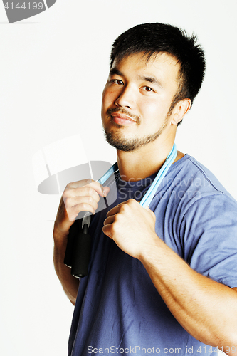 Image of young asian guy with skipping rope on white background ready to 