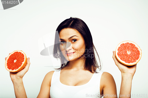 Image of beauty young brunette woman with grapefruit isolated on white background, happy smiling healthy food concept, lifestyle people