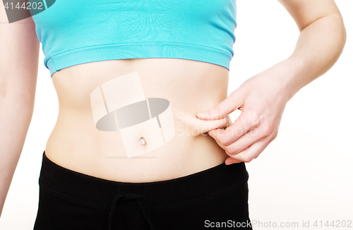 Image of girls stomach measuring with tape isolated on white background, skiny woman on diet, healthcare people concept