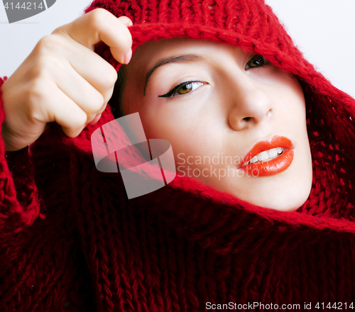 Image of young pretty woman in sweater and scarf all over her face, lifes