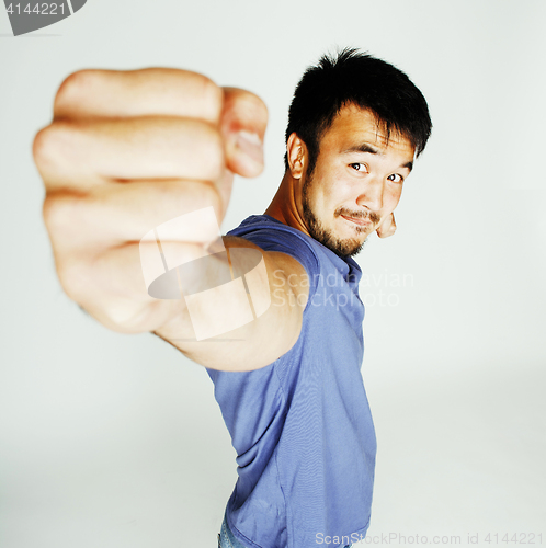 Image of young cute asian man on white background gesturing emotional, po