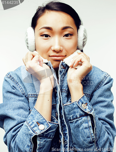 Image of young pretty asian modern fashion hister woman in winter earphones posing cheerful emotional isolated on white background, lifestyle people concept