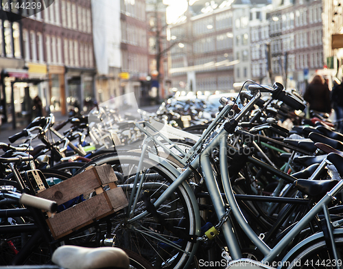 Image of many bicycles on street of Amsterdam city, parking ideal traffic