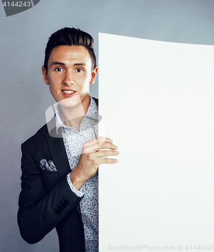 Image of young pretty business man standing on white background, modern hairstyle, posing emotional, lifestyle people concept