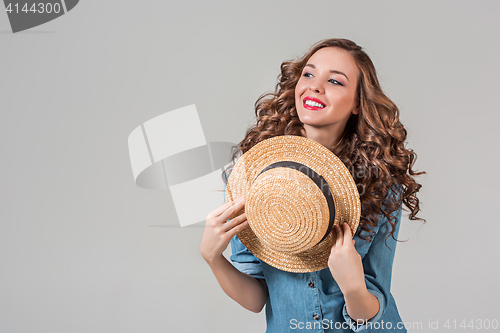 Image of The girl in straw hat