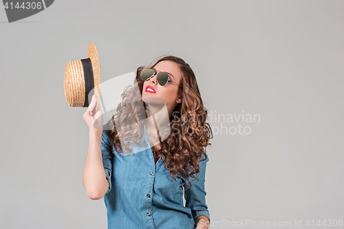 Image of girl in sunglasses and straw
