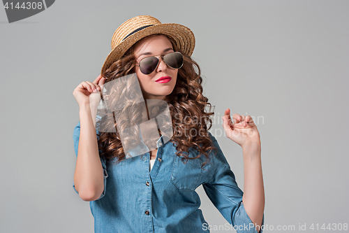 Image of girl in sunglasses and straw