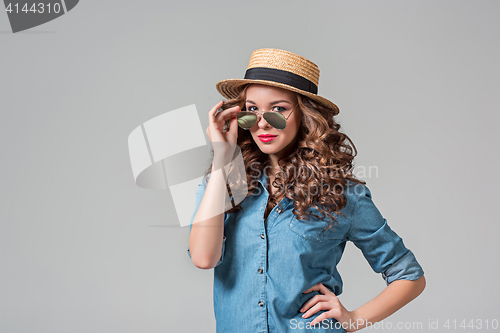 Image of girl in sunglasses and straw