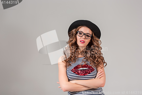 Image of girl in glasses and hat