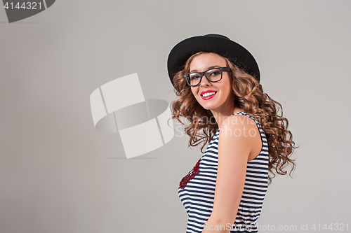 Image of girl in glasses and hat