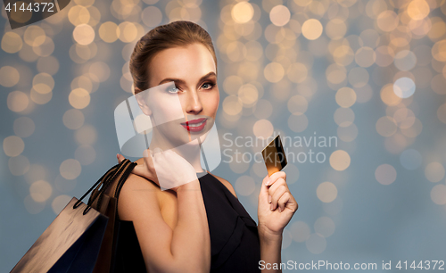 Image of woman with credit card and shopping bags