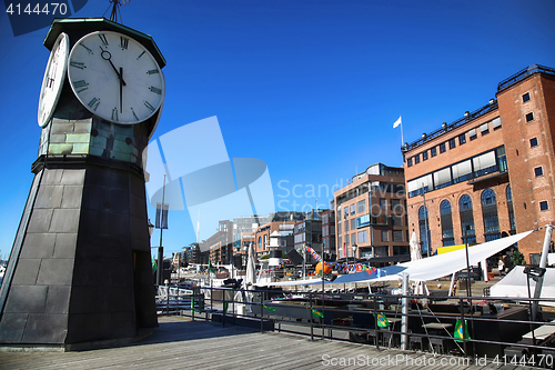 Image of Clock tower on Aker Brygge Dock and modern building in Oslo, Nor