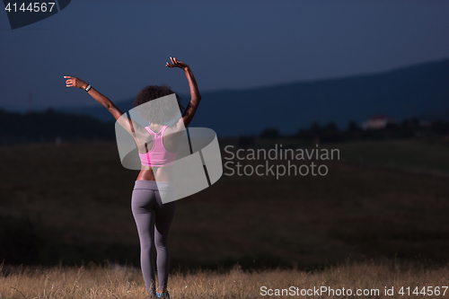 Image of black girl dances outdoors