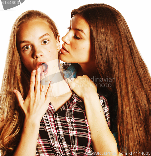Image of two cute teenagers having fun together isolated on white