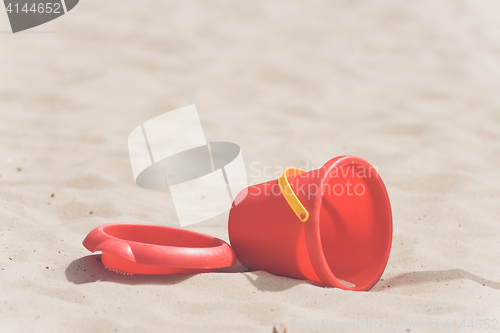 Image of Sandbox with a red bucket