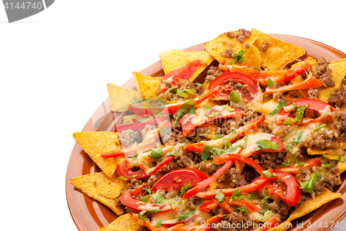 Image of spicy nachos with pork, tomato and pepper