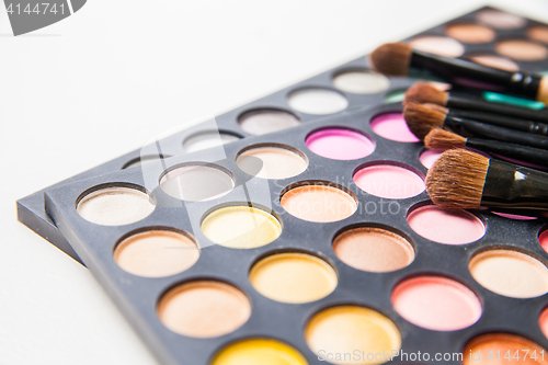 Image of Makeup brushes and make-up eye shadows