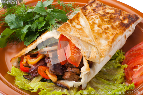 Image of beef fajitas with peppers and tomato