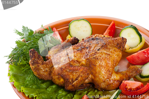 Image of fresh grilled whole chicken with vegetables