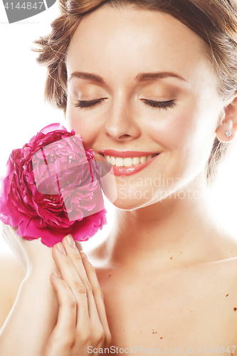 Image of young beauty woman with flower peony pink closeup makeup soft te
