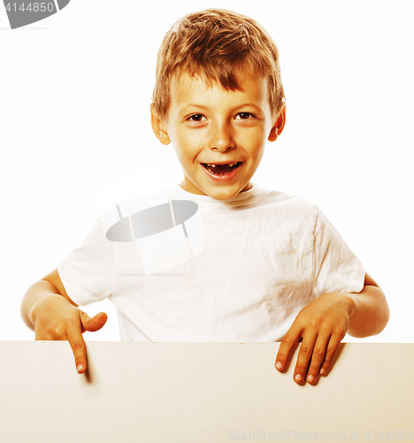 Image of little cute boy holding empty shit to copyspace isolated close u