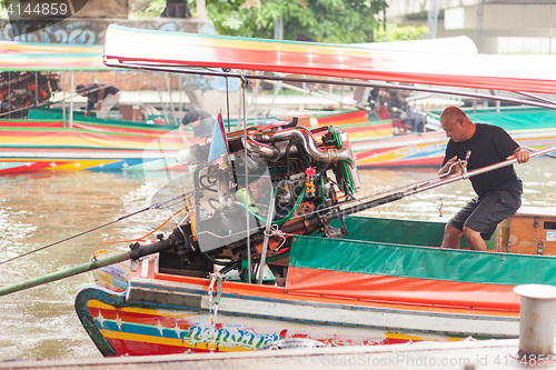 Image of Long-tail boat man, Thailand