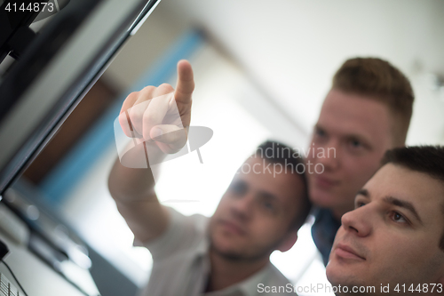 Image of a group of graphic designers at work