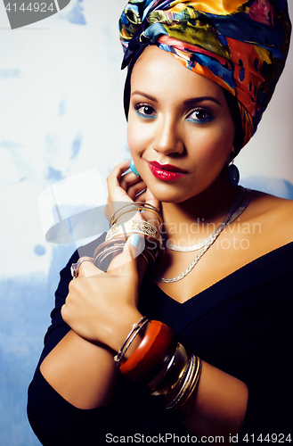 Image of beauty bright african woman with creative make up, shawl on head