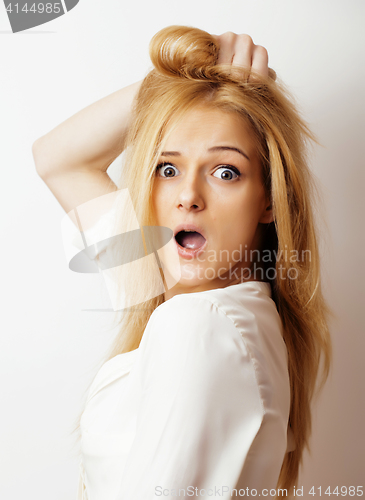 Image of young blond woman on white backgroung gesture thumbs up, isolate