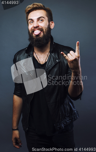 Image of young attractive bearded hipster man gesturing emotional screami