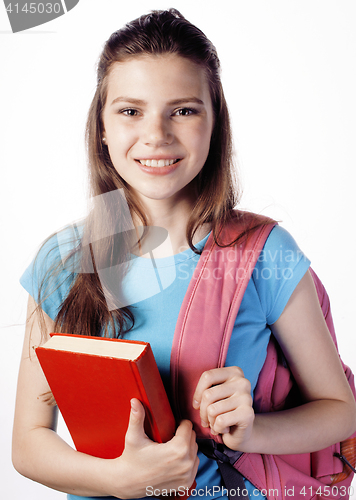 Image of young cute teenage girl posing cheerful against white background with books and backpack