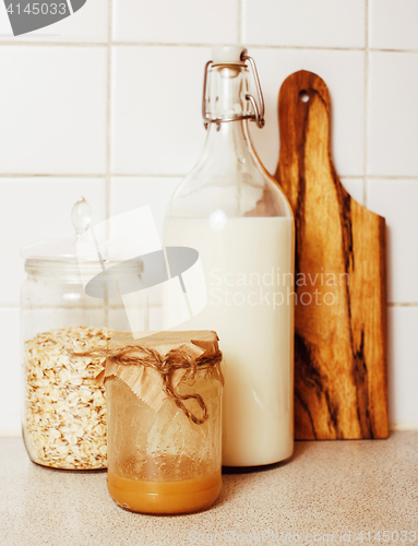 Image of real comfort wooden kitchen with breakfast ingredients close up