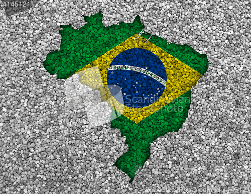 Image of Map and flag of Brazil on poppy seeds