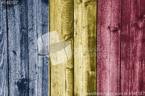 Image of Flag of Chad on weathered wood