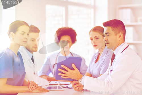 Image of group of happy doctors meeting at hospital office