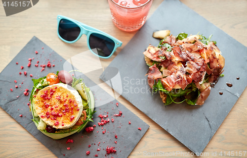Image of goat cheese and ham salads on cafe table