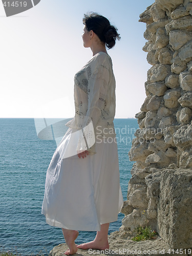 Image of Lonely Young Woman Looks on Sea