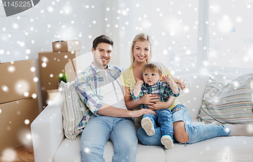 Image of happy family with boxes moving to new home