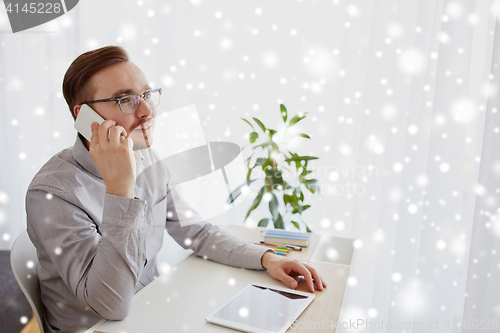 Image of happy creative male worker calling on smartphone