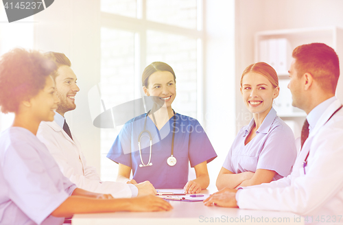 Image of group of happy doctors meeting at hospital office