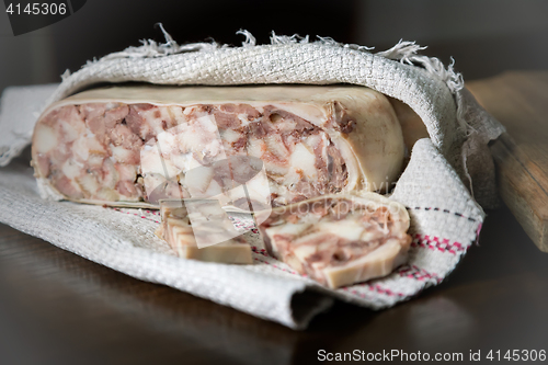 Image of Appetizer of meat wrapped in a napkin.