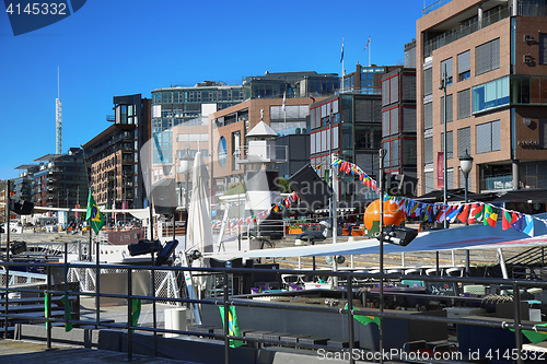 Image of OSLO, NORWAY – AUGUST 17, 2016: People walking on modern distr