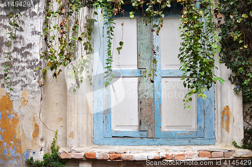 Image of Wooden window on old dirty wall