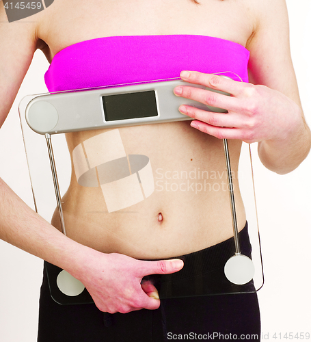 Image of girls stomach measuring with tape isolated on white background, skiny woman on diet, healthcare people concept