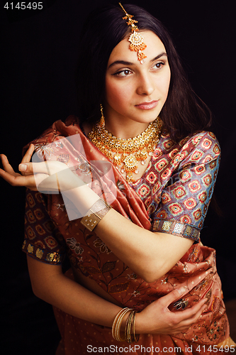 Image of beauty sweet real indian girl in sari smiling on black background, lifestyle people concept